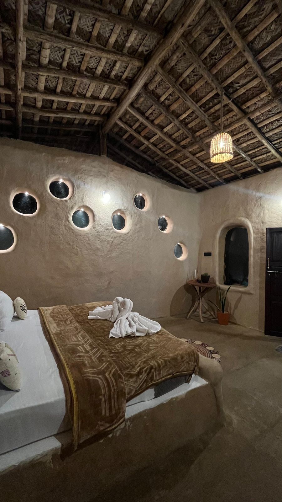 Mud cottage interior with circular windows